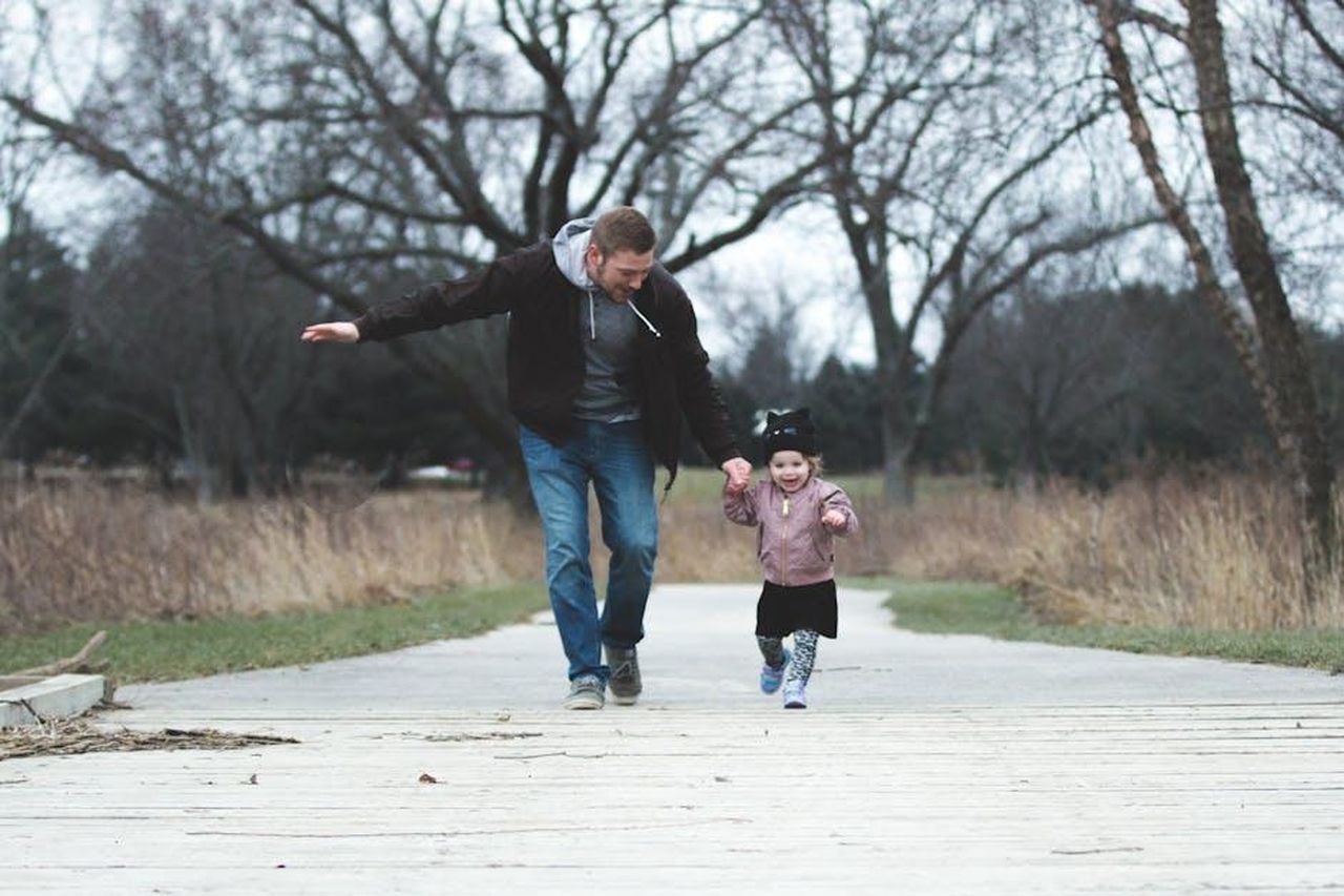 Source: Josh Willink - pexels - Dad and daughter enjoying a walk in the park, symbolizing love and togetherness.