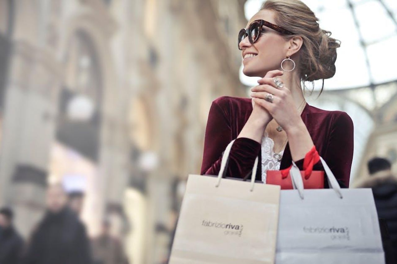 Source: Andrea Piacquadio - pexels - Stylish woman with shopping bags in Galleria Vittorio Emanuele II, Milan.
