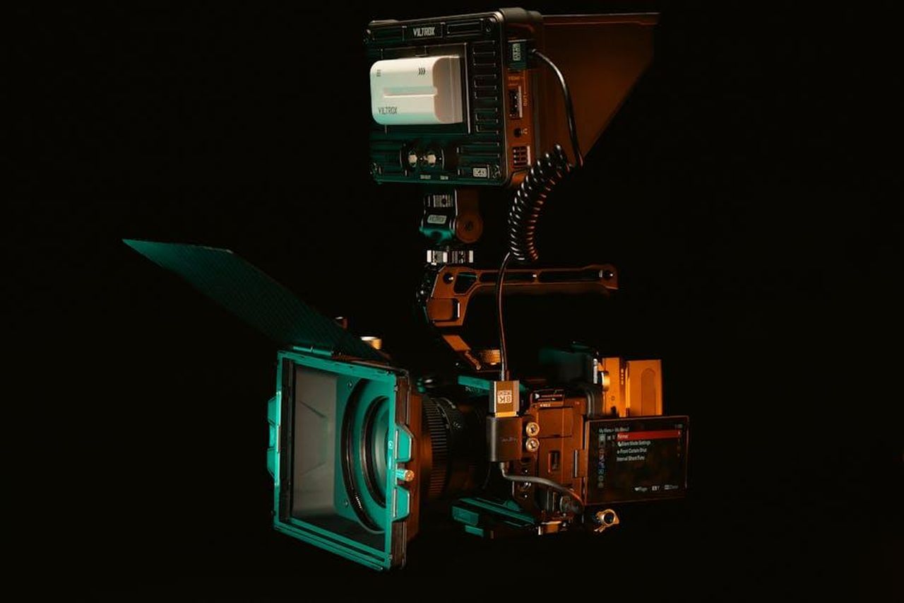 Source: Jakub Zerdzicki - pexels - A detailed view of a cinema camera rig setup with Viltrox monitor and accessories.