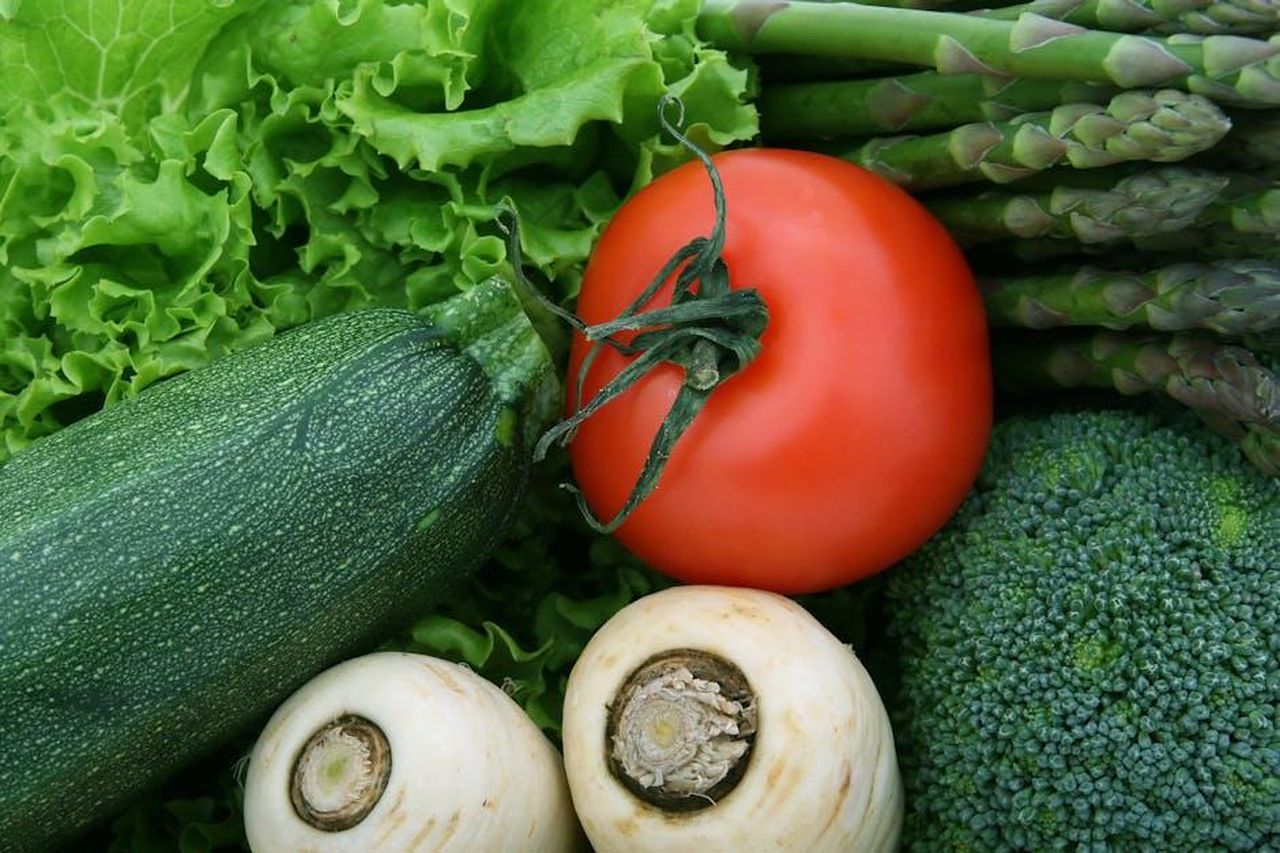 Source: Robert Owen-Wahl - pexels - A vibrant close-up of fresh vegetables, including tomato, zucchini, and broccoli, perfect for healthy eating imagery.