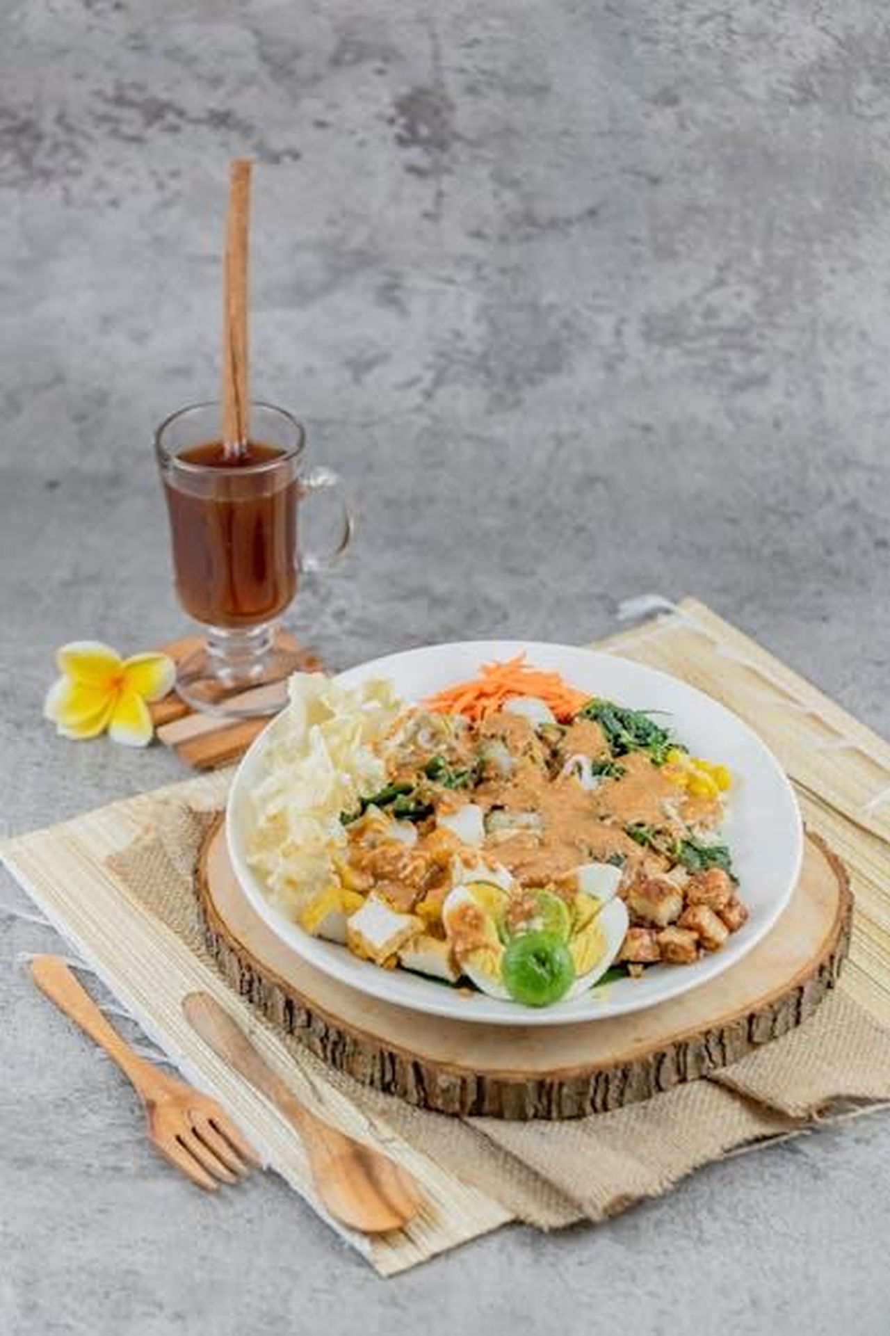 Source: Dovinda Rd - pexels - Fresh Gado Gado salad with mixed vegetables and peanut sauce served with herbal tea.