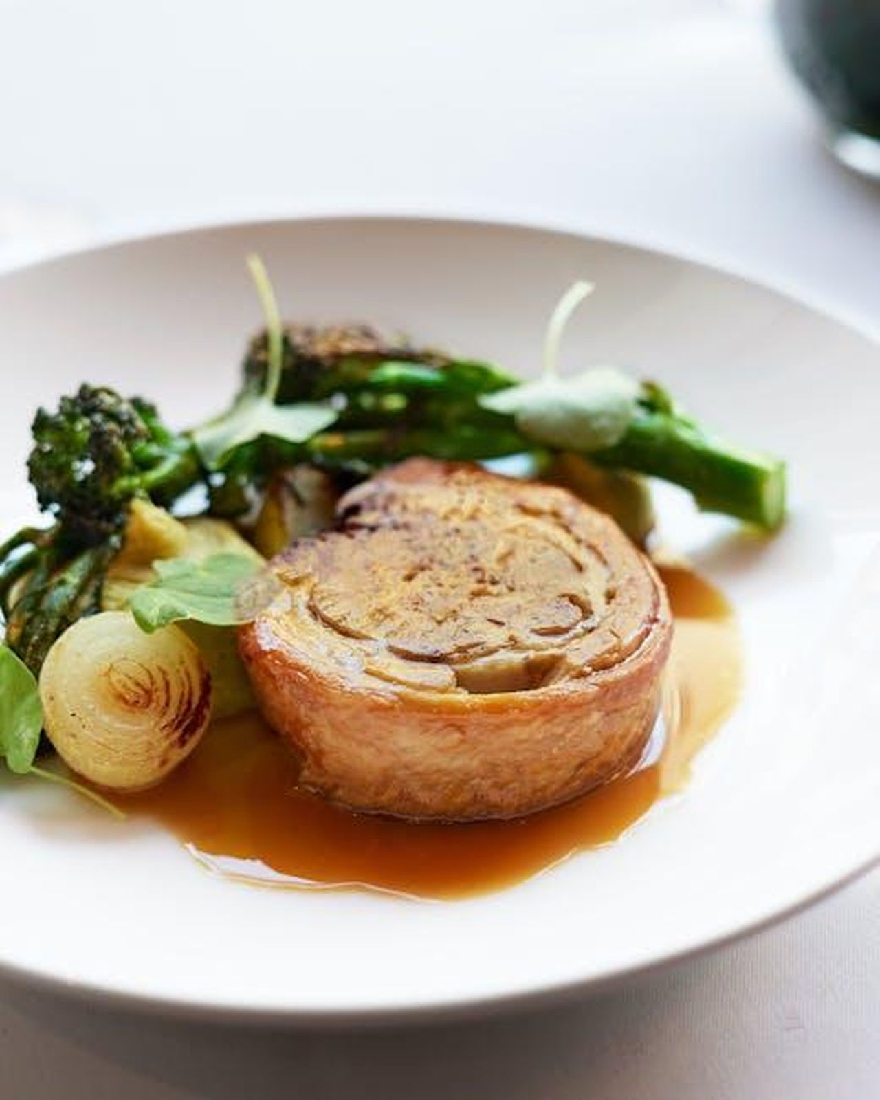 Source: Max Griss - pexels - Elegant dish featuring a gourmet main course served with roasted vegetables and sauce.