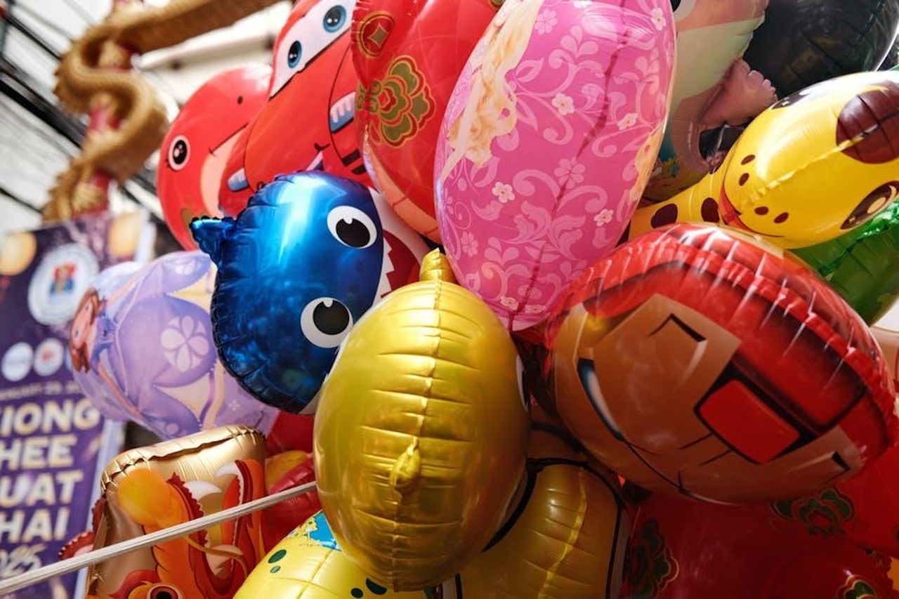 Source: Eggy Clicks - pexels - Vibrant collection of inflatable character balloons at a festive indoor event.