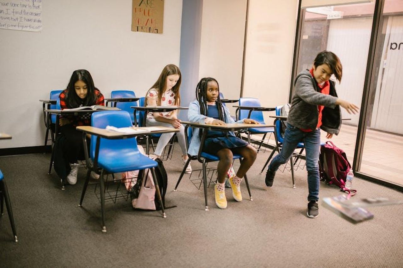 Source: RDNE Stock project - pexels - Students in a classroom experiencing a bullying situation among peers.