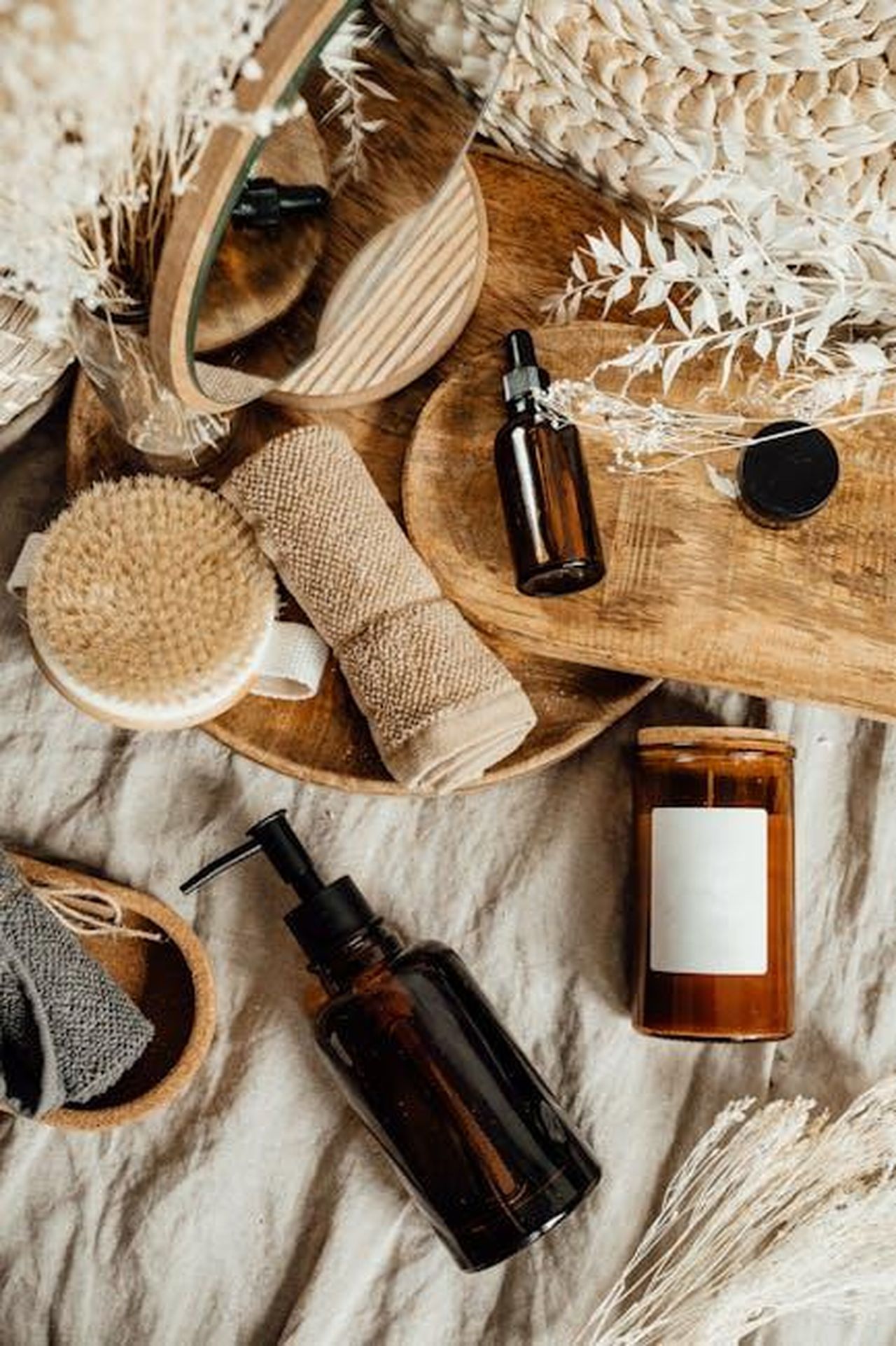 Source: Alesia Kozik - pexels - Aesthetic arrangement of natural skincare products and accessories on a wooden tray.