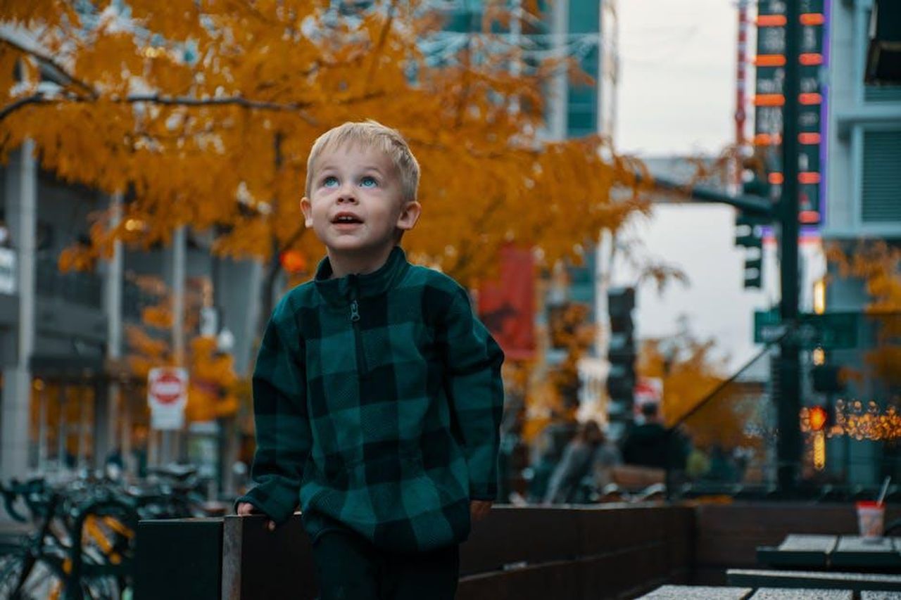 Source: Brett Sayles - pexels - Young boy in a plaid jacket exploring downtown Boise in the fall.