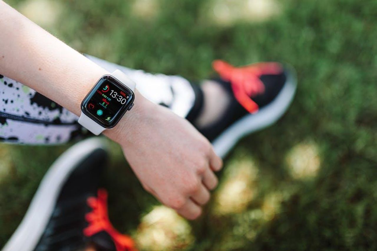 Source: Photo By: Kaboompics.com - pexels - Close-up of a smartwatch on a woman's wrist during outdoor fitness activity.