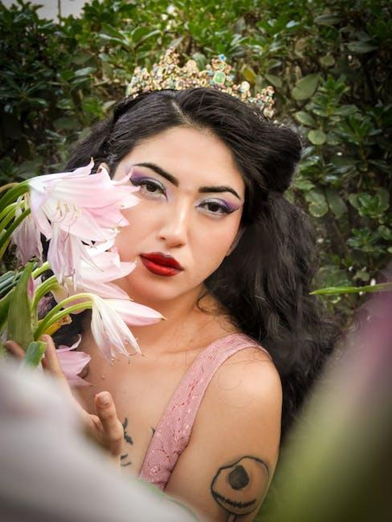 Source: Ericka Sánchez - pexels - Stylish woman with floral elements and a crown enjoying a moment in nature.
