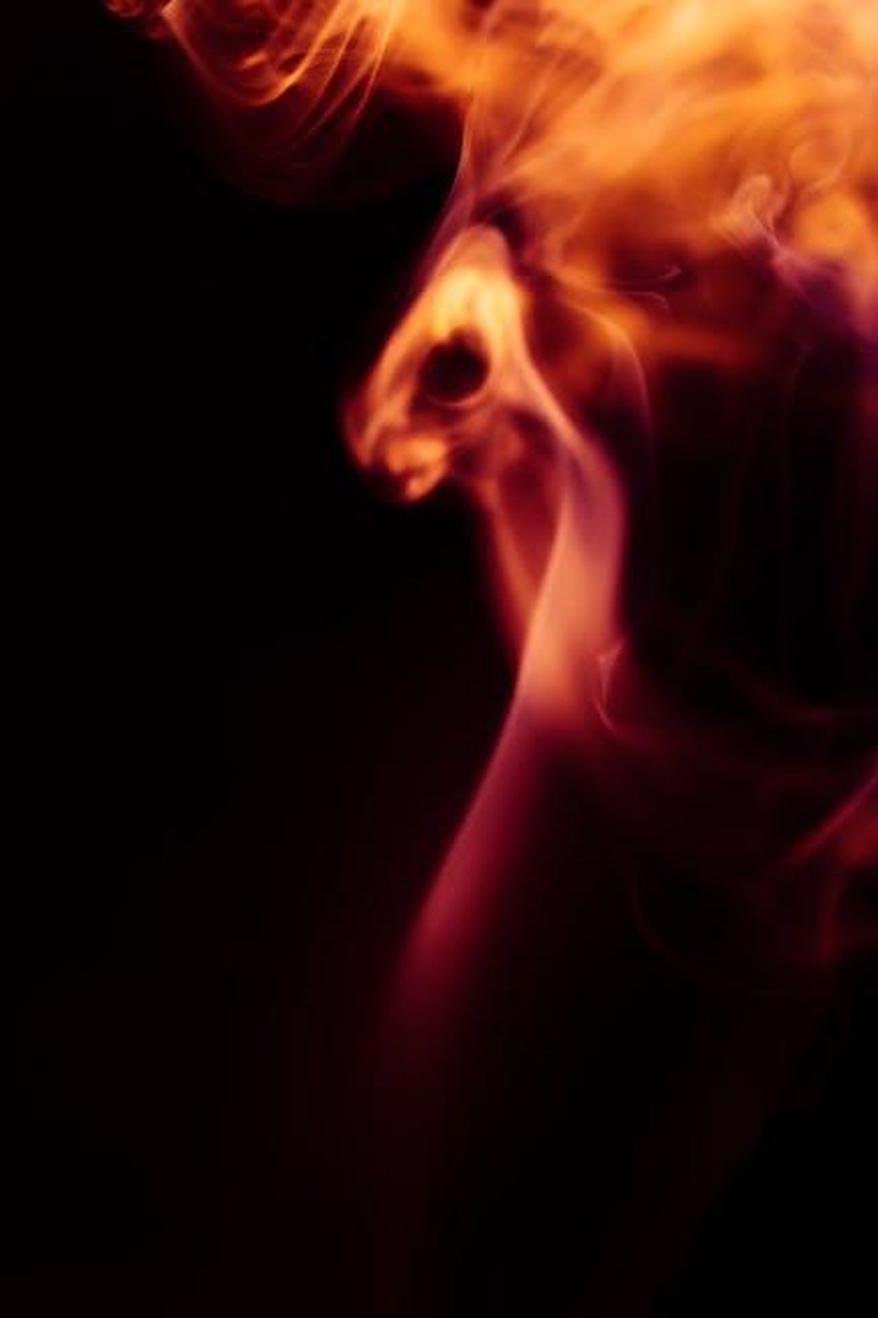 Source: Marek Piwnicki - pexels - A mesmerizing capture of swirling flames and dark smoke in an abstract form.