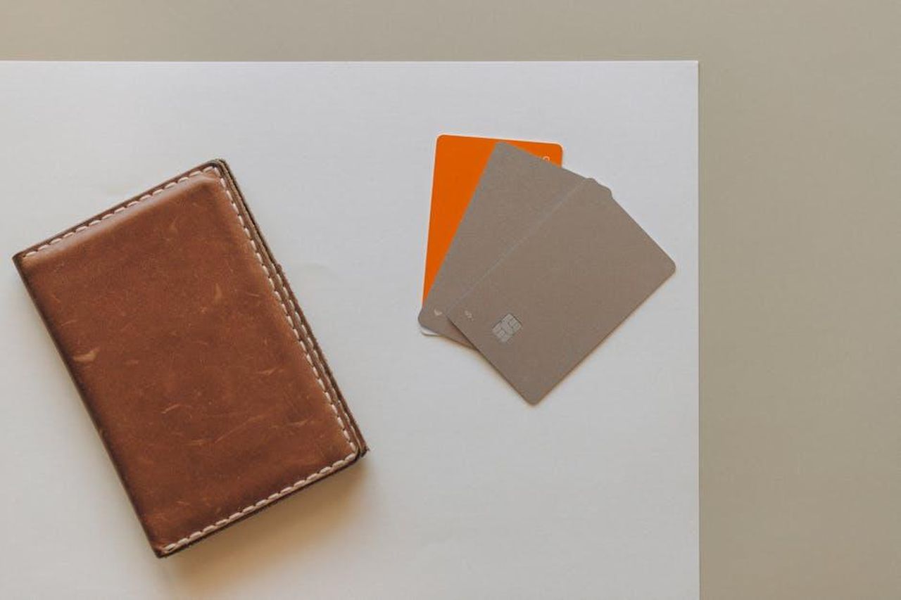Source: Nataliya Vaitkevich - pexels - A leather wallet and credit cards on a minimalist background, ideal for financial themes.