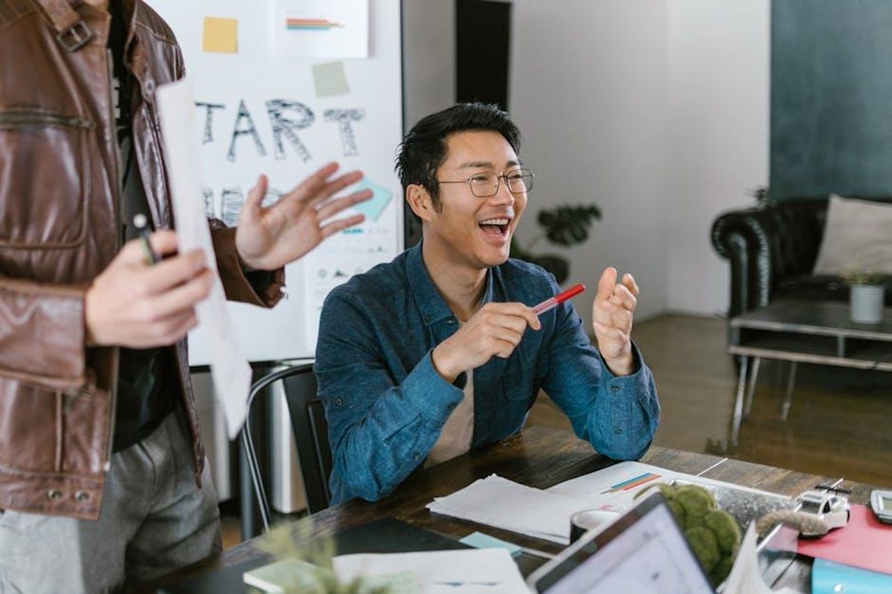 Source: RDNE Stock project - pexels - Engaged team members in a lively office meeting discussing startup ideas and innovation.